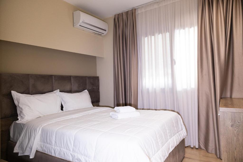Postel nebo postele na pokoji v ubytování 4R Colombo Hotel