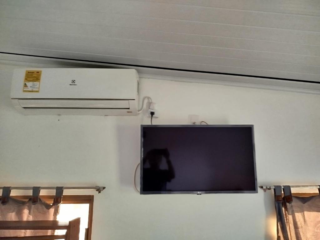 TV a/nebo společenská místnost v ubytování Kanaq Hotel Tours