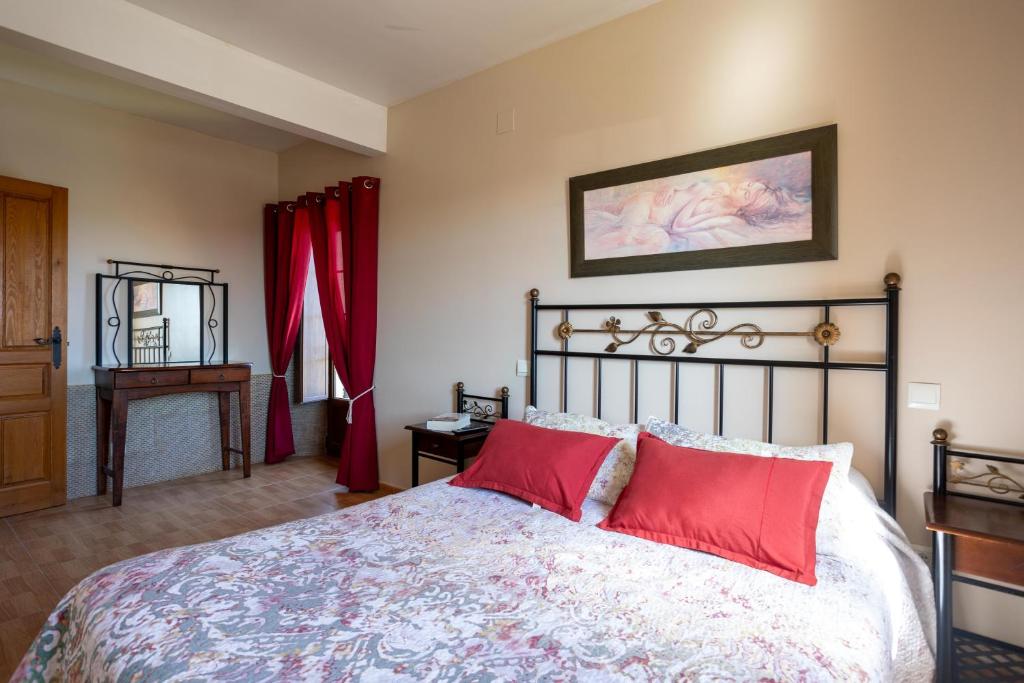 Postel nebo postele na pokoji v ubytování Apartamentos Rurales Las Dos Torres