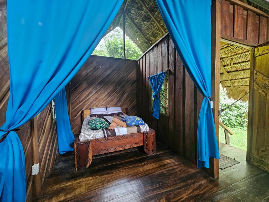Postel nebo postele na pokoji v ubytování Wildlife Lodge Cahuita