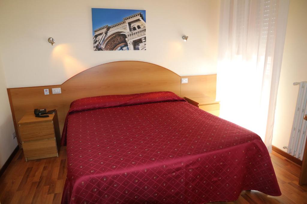 Postel nebo postele na pokoji v ubytování Hotel Palladio