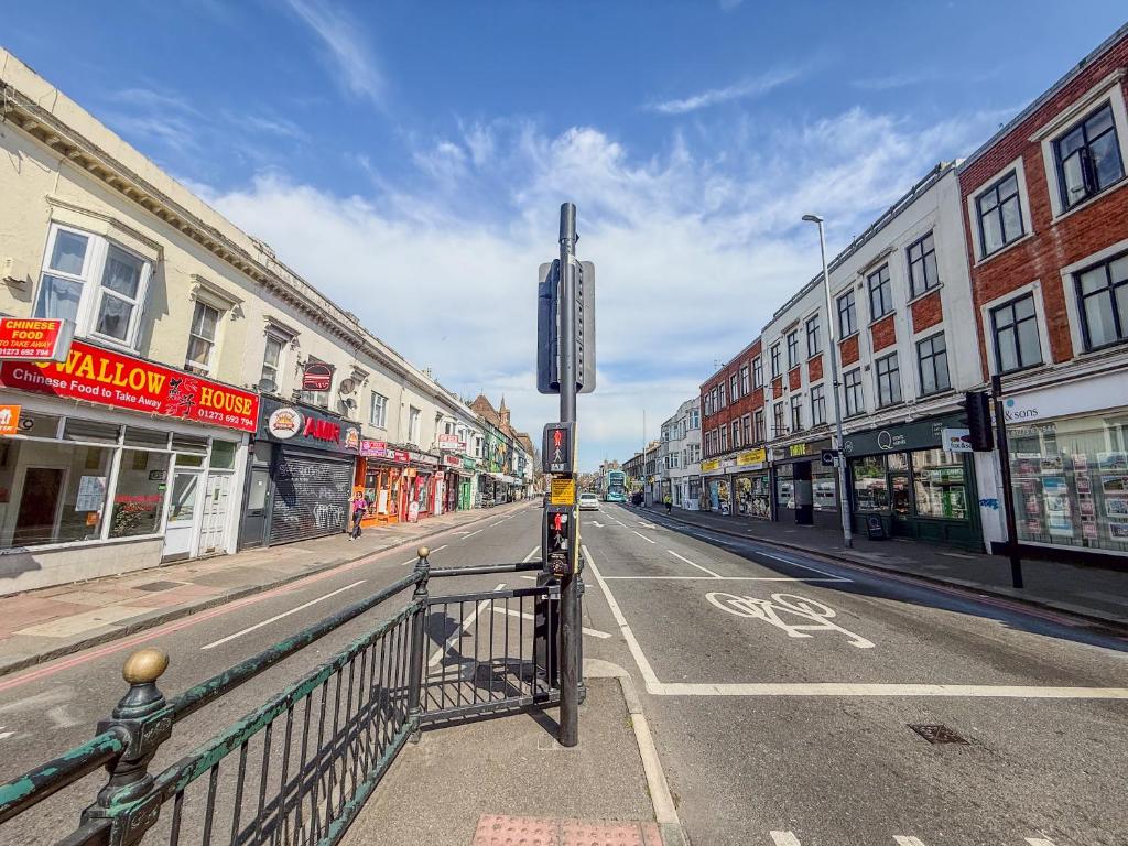 an empty street in a city with buildings at Bright and Spacious 2BR Maisonette Sleeps 8, Game Room, 5 mins to Brighton Beach and City Centre in Brighton & Hove
