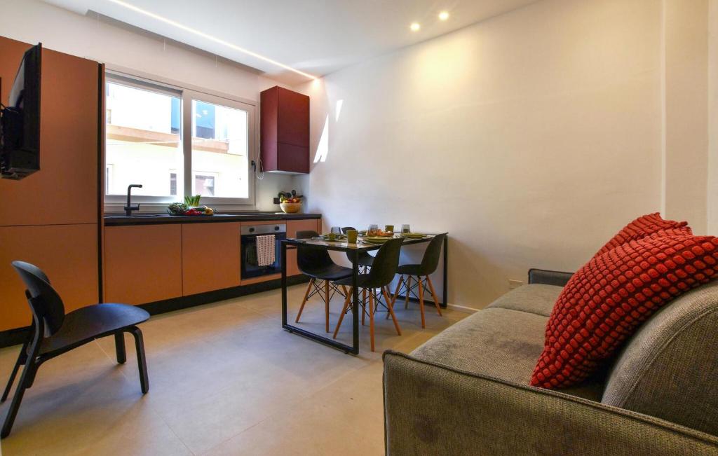 a living room with a couch and a table at 2 Bedroom Gorgeous Apartment In Trappeto in Trappeto