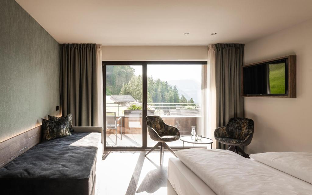 TV a/nebo společenská místnost v ubytování Hotel Belaval
