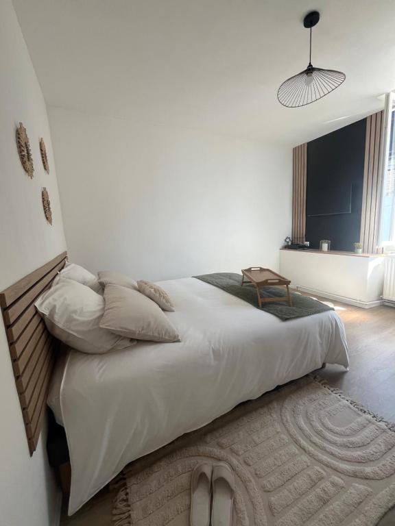 En eller flere senge i et værelse på La P'tite Maison D'Auron