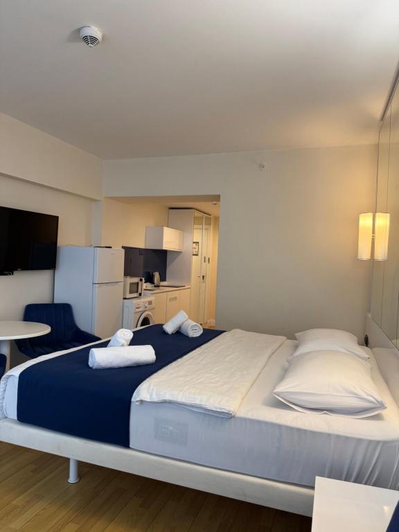 Postel nebo postele na pokoji v ubytování Orbi City Central Luxury Aparthotel - Sea View Suites Batumi