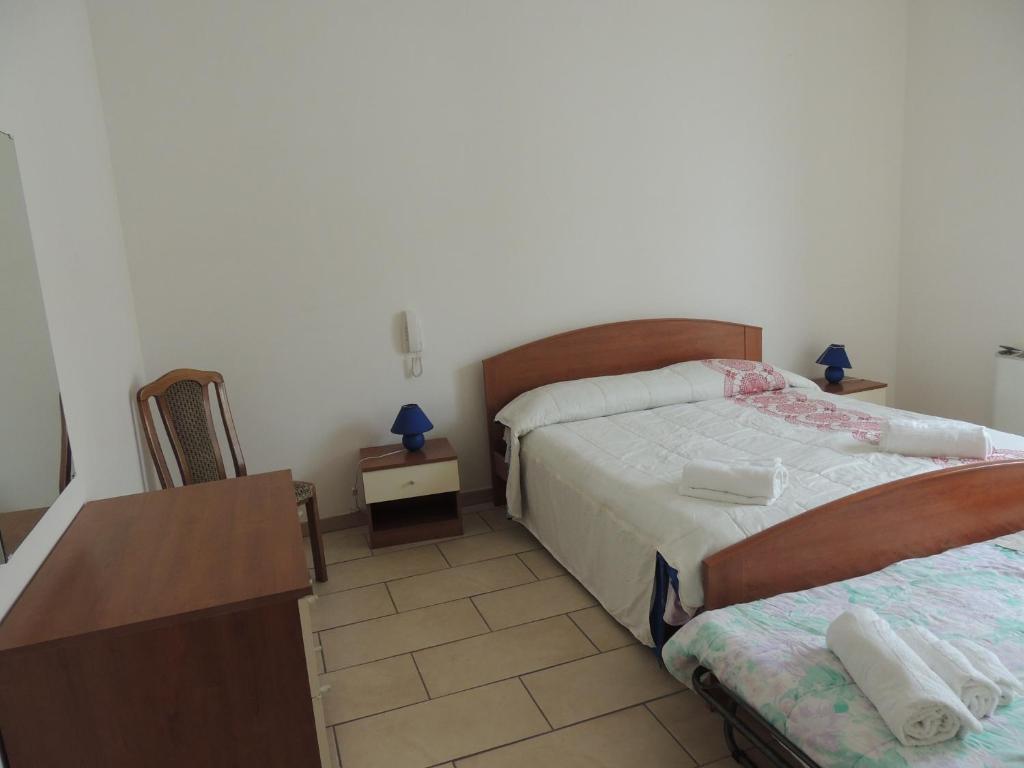Postel nebo postele na pokoji v ubytování Casa Vacanze Eufemia