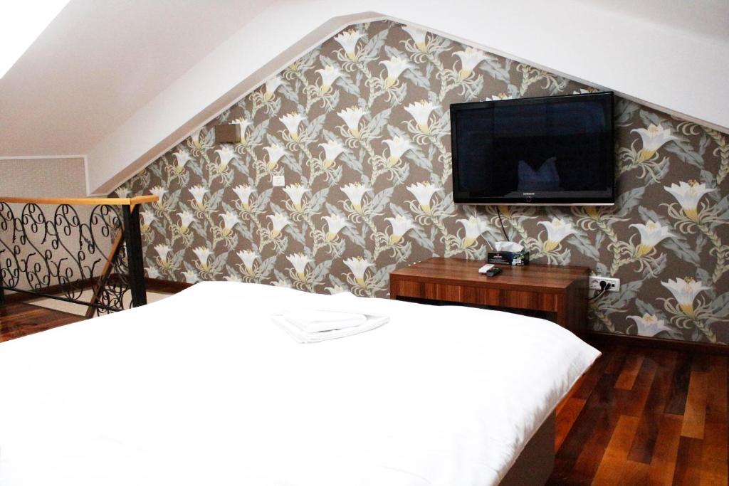 Postel nebo postele na pokoji v ubytování Hotel Papion