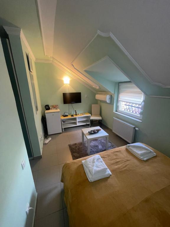 Postel nebo postele na pokoji v ubytování Garni Hotel Bella
