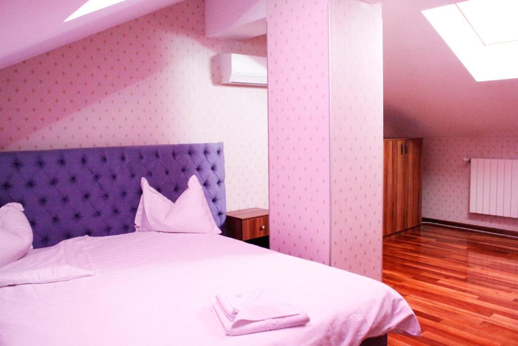 Postel nebo postele na pokoji v ubytování Hotel Papion