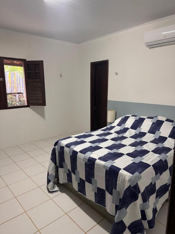 En eller flere senge i et værelse på Casa Vovó Maria - De frente para o de Japaratinga