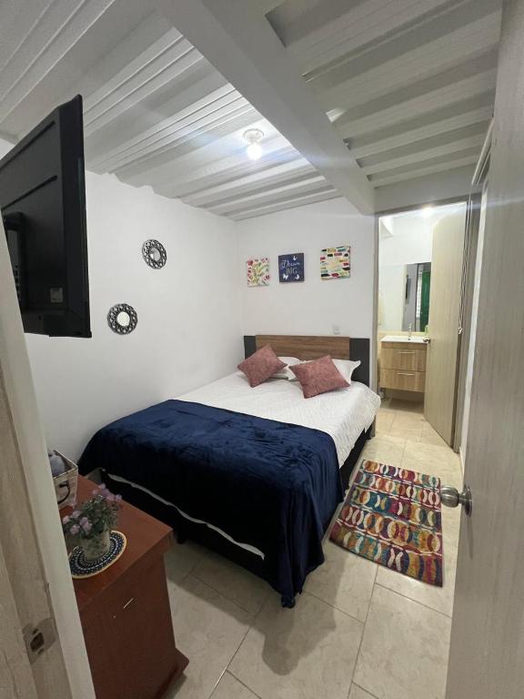 Postel nebo postele na pokoji v ubytování Apartaestudio astromelias A