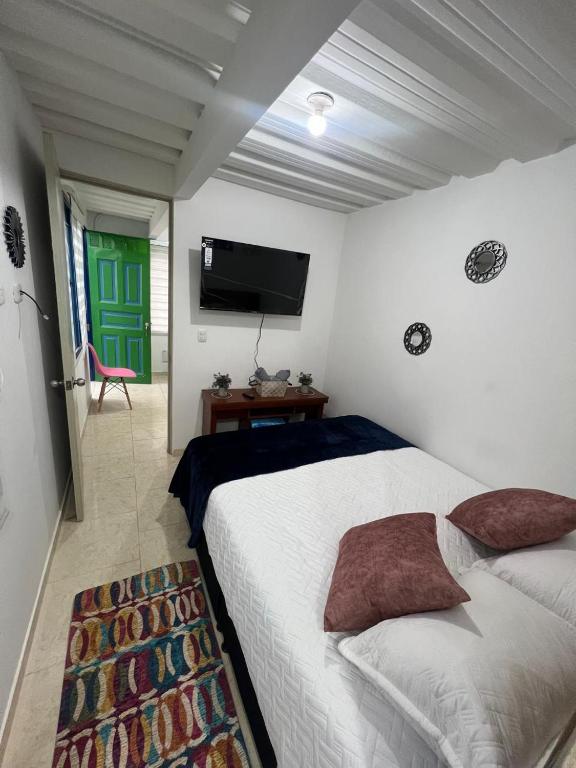 Postel nebo postele na pokoji v ubytování Apartaestudio astromelias A
