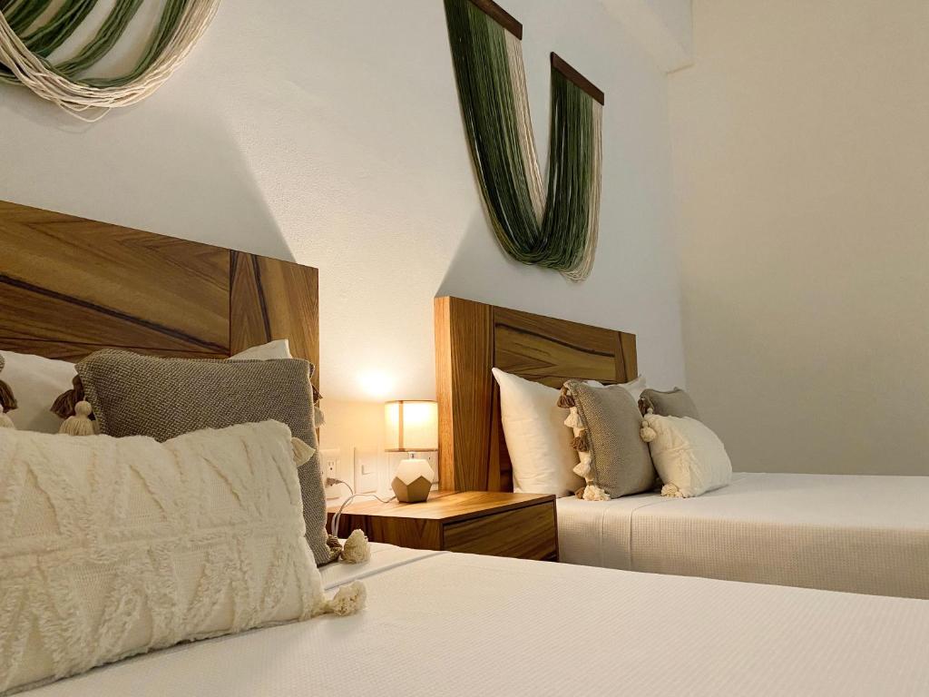 Postel nebo postele na pokoji v ubytování Itare Beach House