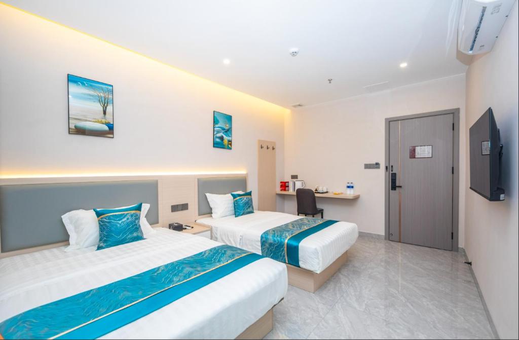 Postel nebo postele na pokoji v ubytování Zhuhai Xiangzhou Yijing Express Hotel