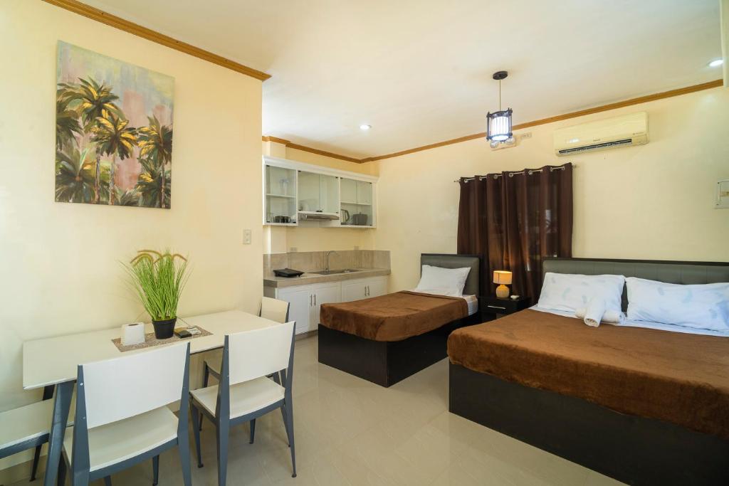 Kuchyň nebo kuchyňský kout v ubytování Mifaña Suites - Panglao Island