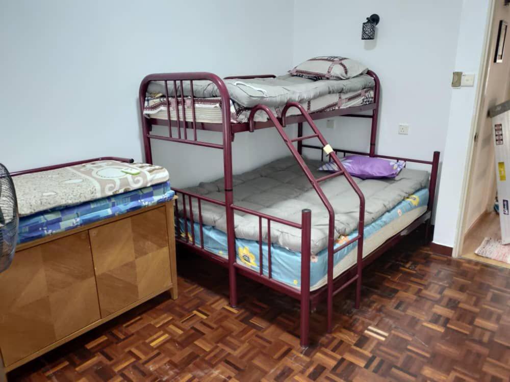 a couple of bunk beds in a room at Seri Bulan Coastal Homestay in Kampung Teluk Kemang