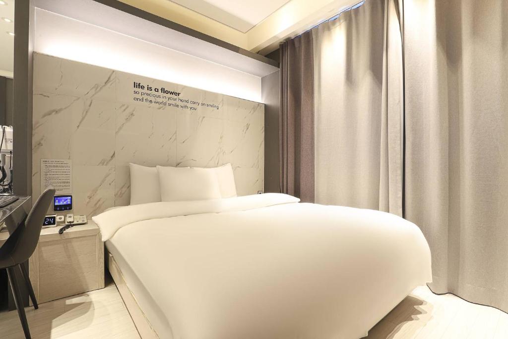 Postel nebo postele na pokoji v ubytování Hotel OSCAR
