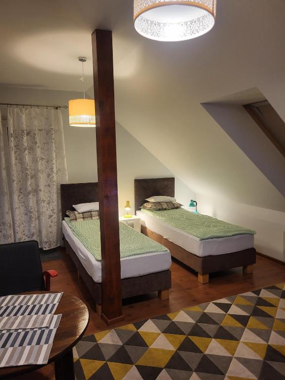 Postel nebo postele na pokoji v ubytování Pokoje Pod 22 Bis