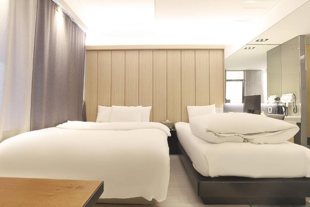 Postel nebo postele na pokoji v ubytování Hotel OSCAR