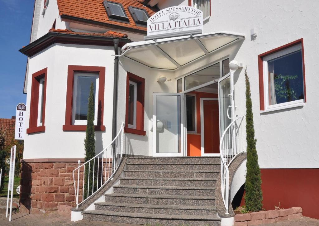 a white house with stairs in front of it at Häuser der Villa Italia in Marktheidenfeld