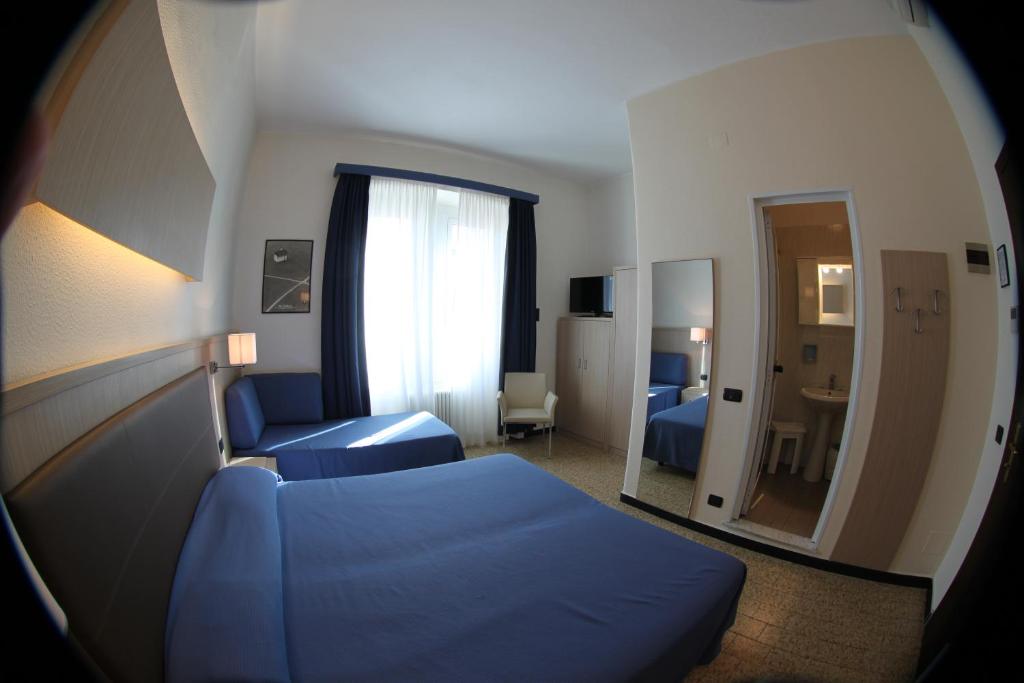 Postel nebo postele na pokoji v ubytování Hotel Stella