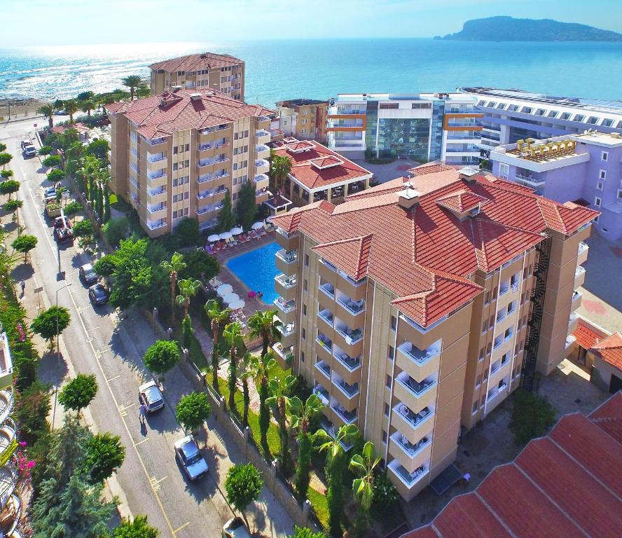 an overhead view of a city with buildings and the ocean at Saritas Hotel ONLY FAMILY CONCEPT in Alanya