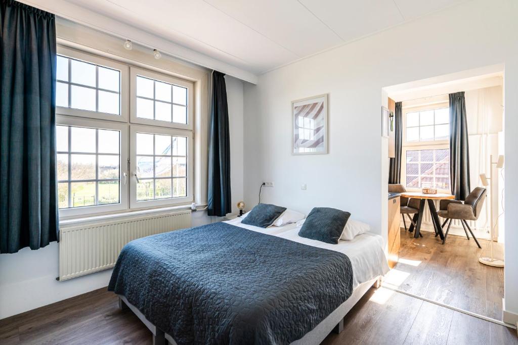 Postel nebo postele na pokoji v ubytování Duinhotel Haga