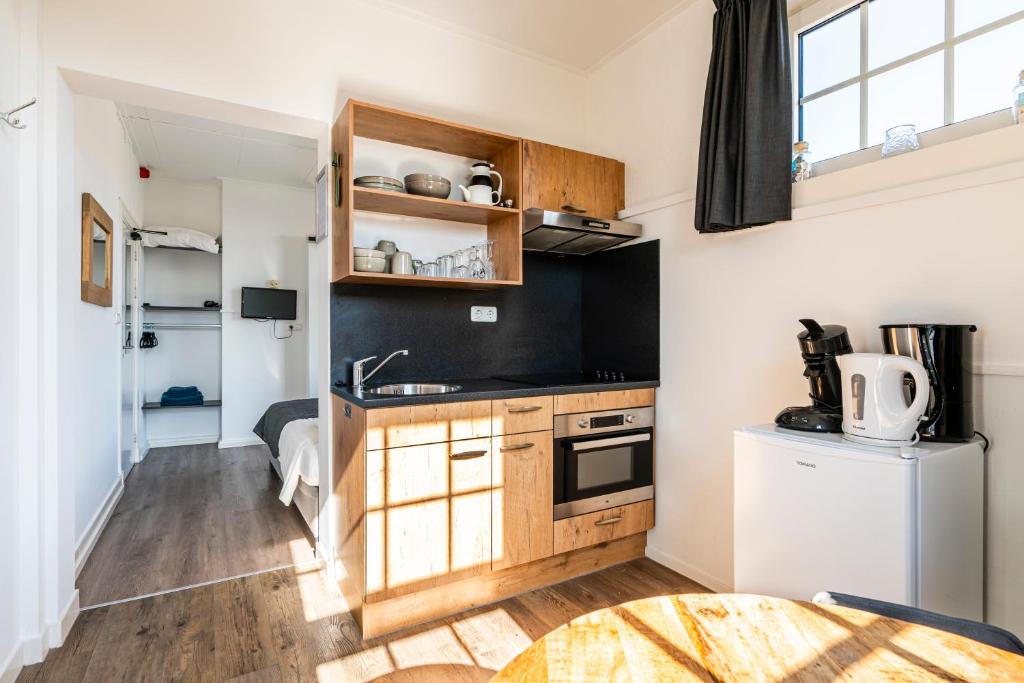 Kuchyň nebo kuchyňský kout v ubytování Duinhotel Haga