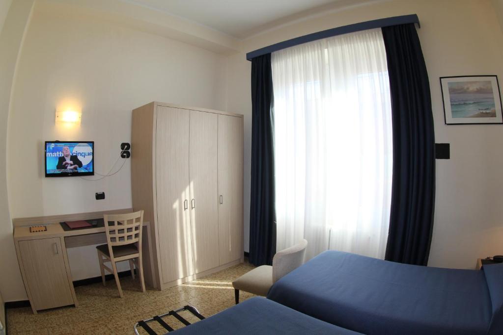 TV a/nebo společenská místnost v ubytování Hotel Stella