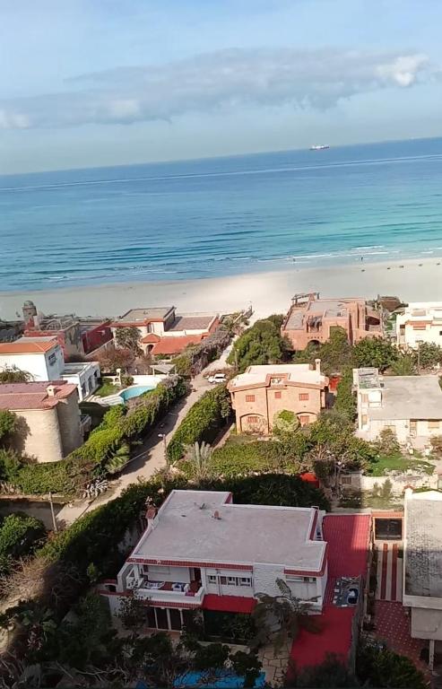 a view of a beach with houses and the ocean at Condo Studio Paradise Beach in Alexandria