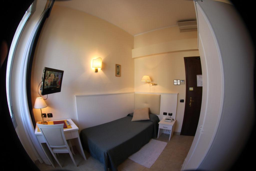 Postel nebo postele na pokoji v ubytování Hotel Stella