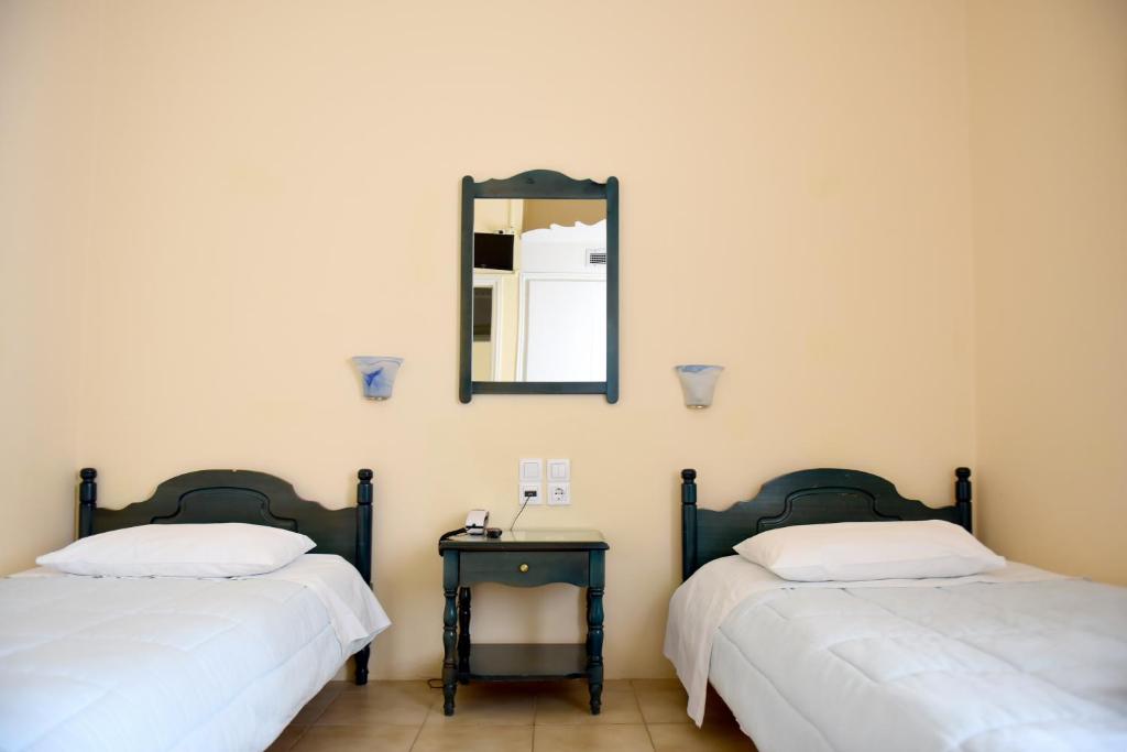 Postel nebo postele na pokoji v ubytování Sidra Hotel