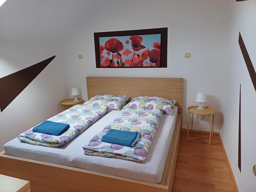 Postel nebo postele na pokoji v ubytování 4Season Apartman