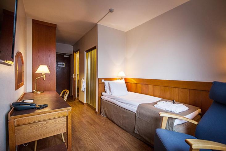 Postel nebo postele na pokoji v ubytování First Hotel Bengtsfors