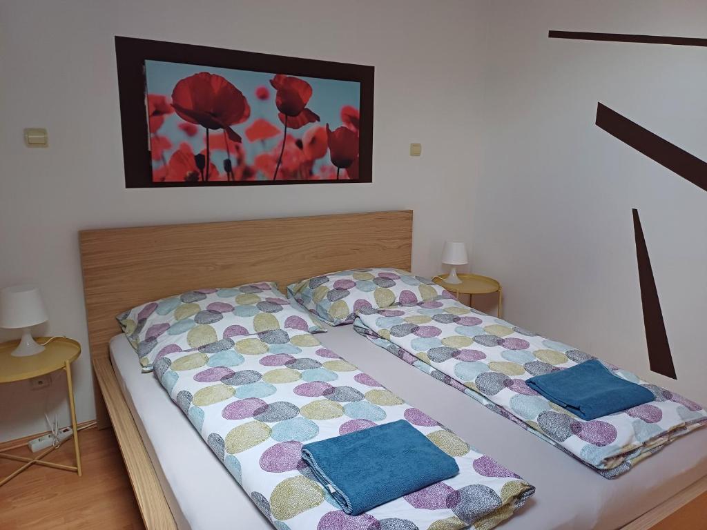 Postel nebo postele na pokoji v ubytování 4Season Apartman