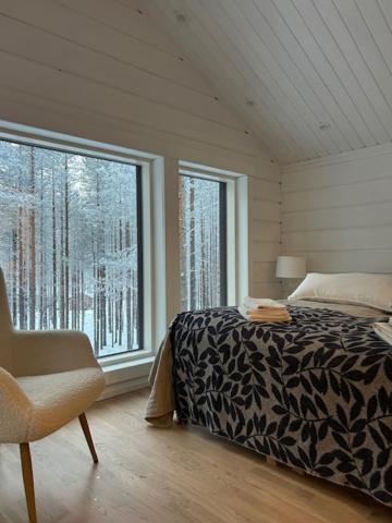 Postel nebo postele na pokoji v ubytování Log-house at Pyhätunturi ski resort.