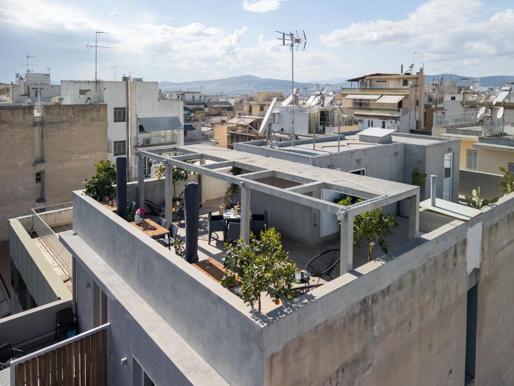 a view of a city from the roof of a building at Trikoupi 95 in Athens