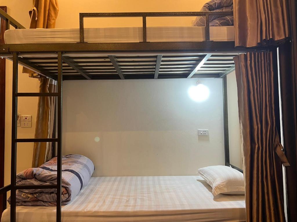 Postel nebo postele na pokoji v ubytování Ha Giang Ali Hostel