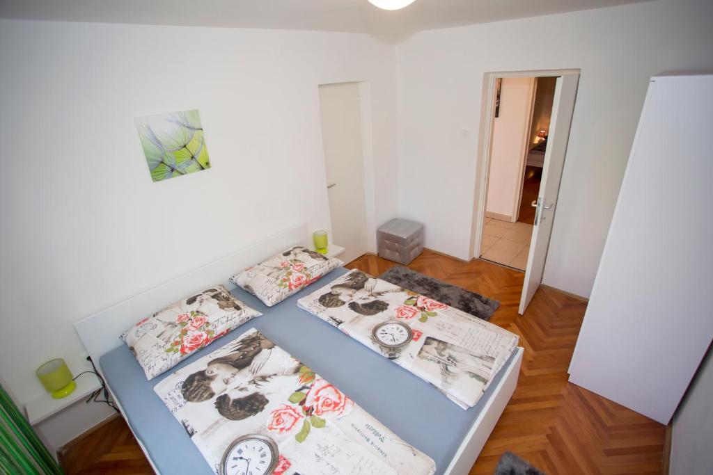 מיטה או מיטות בחדר ב-Dream Apartment Rijeka 3