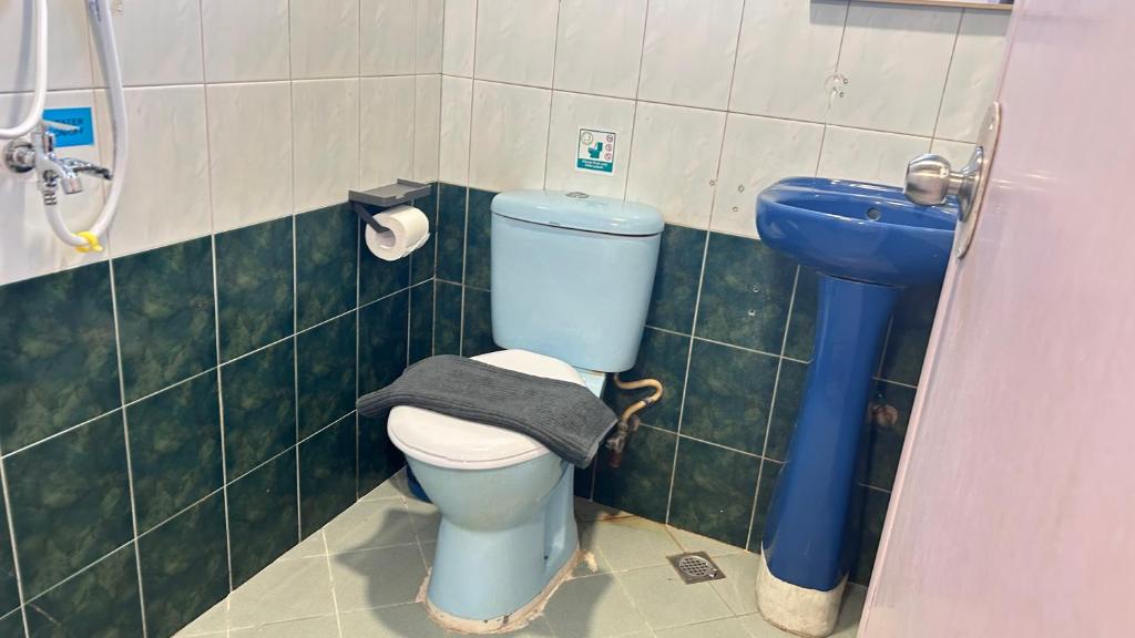 Koupelna v ubytování NEW Xing Yue Hotel 星悦自助酒店
