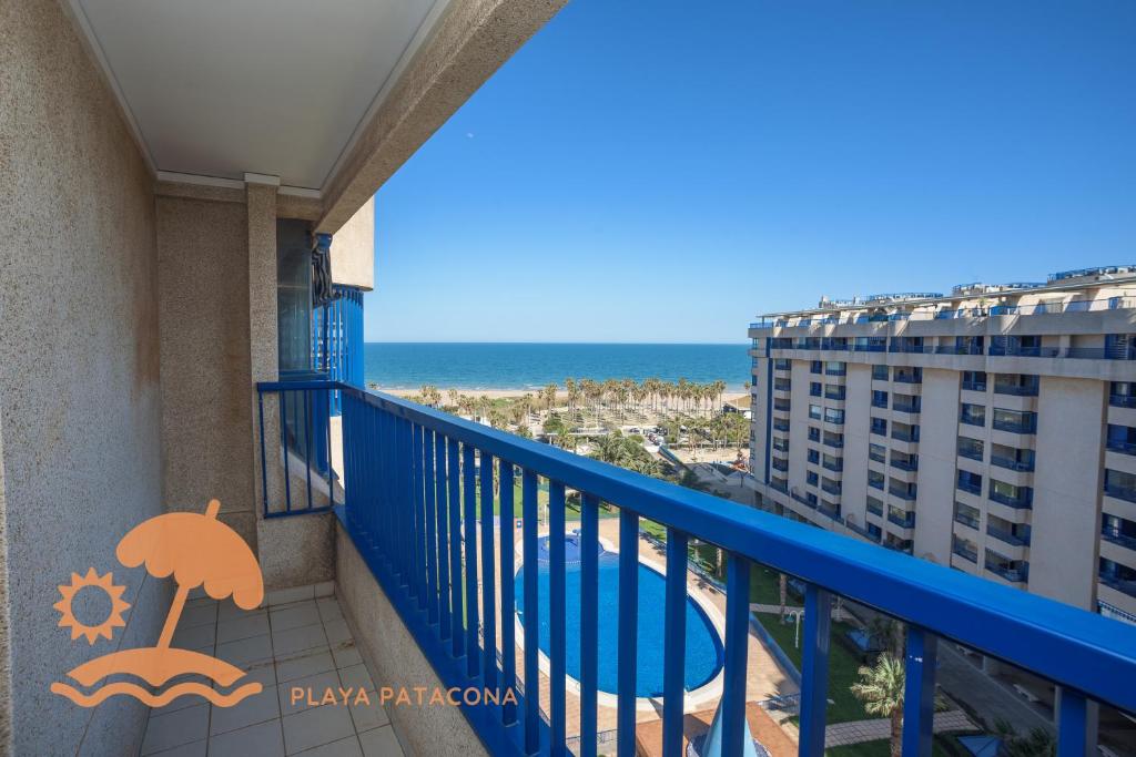 a balcony with a view of the beach at Patacona Resort Apartments Primera Linea in Valencia