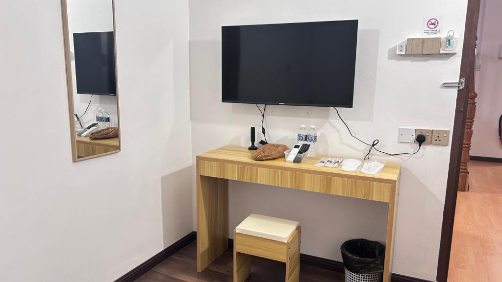 TV a/nebo společenská místnost v ubytování NEW Xing Yue Hotel 星悦自助酒店
