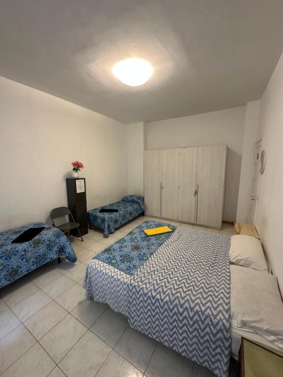 Postel nebo postele na pokoji v ubytování Stanza privata per 4