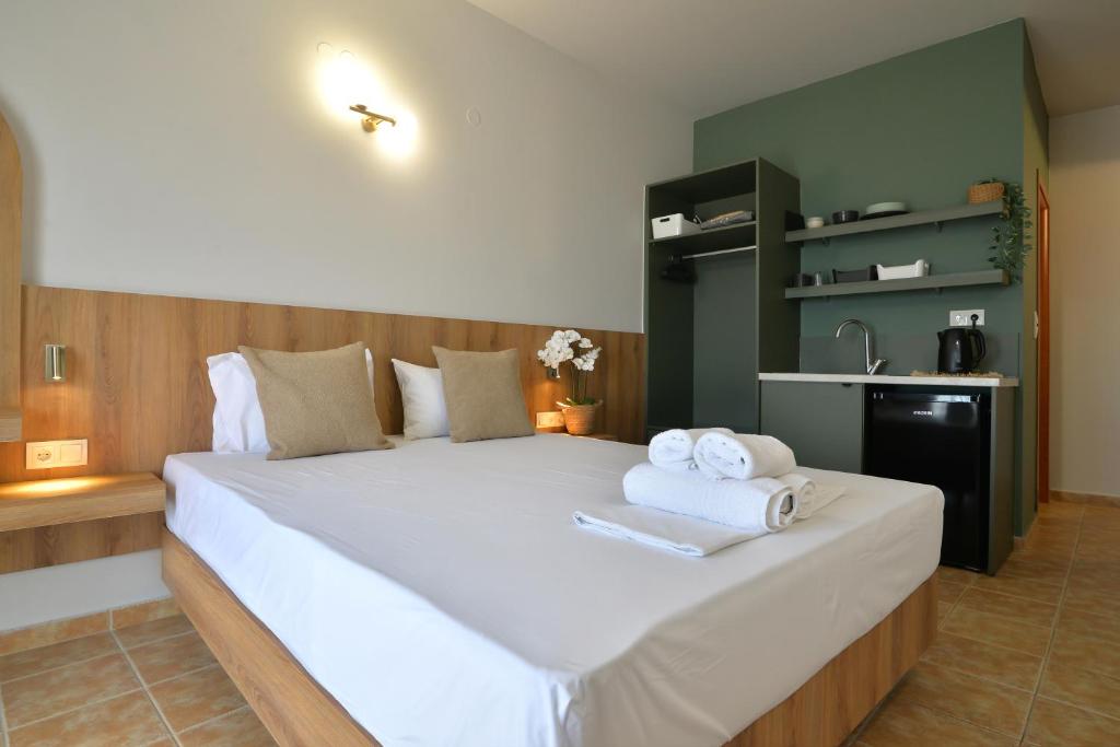 Postel nebo postele na pokoji v ubytování Hotel Akti