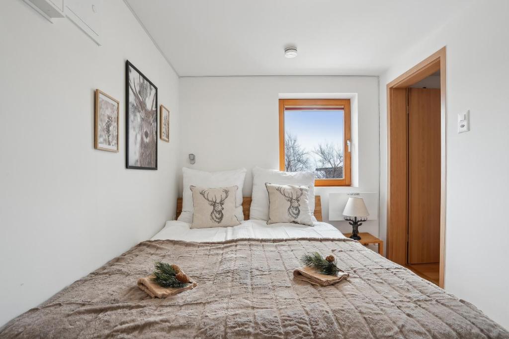 Postel nebo postele na pokoji v ubytování INN JOY Apartments - idyllische Bergsicht