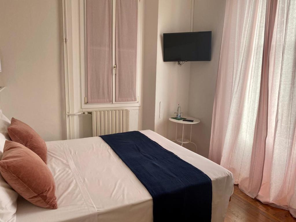 Postel nebo postele na pokoji v ubytování Hotel Loveno