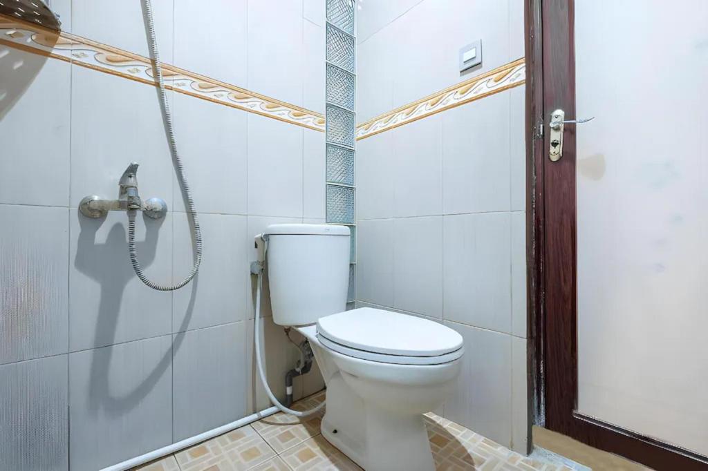 Koupelna v ubytování OYO Collection O 1032 Rahayu Residence Syariah