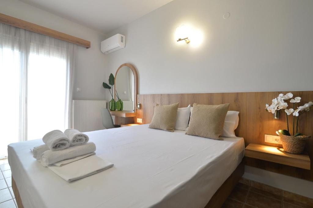 Postel nebo postele na pokoji v ubytování Hotel Akti