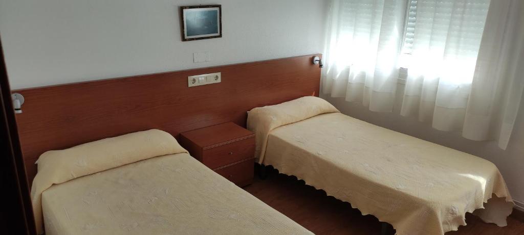 Postel nebo postele na pokoji v ubytování Hotel A Roda